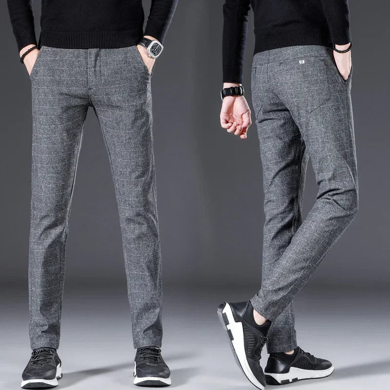Men's slim fit grey plaid casual pants with black sneakers, front and back view on gray background
