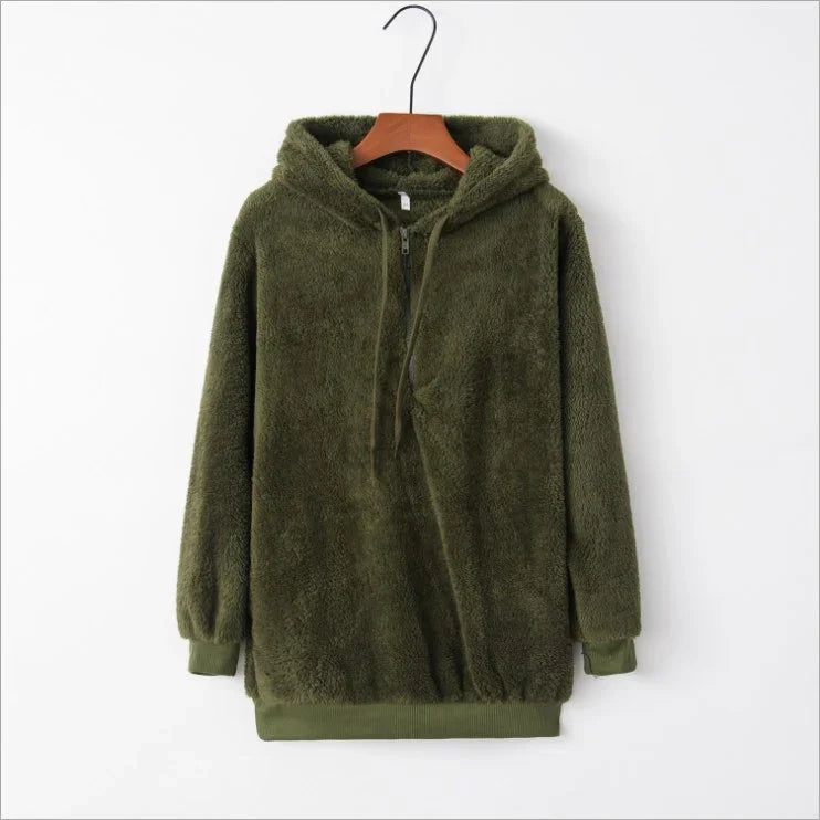 Olive green fuzzy fleece hoodie with half-zip and drawstring, hanging on wooden hanger