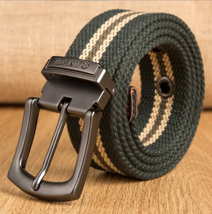 Green woven fabric belt with white stripes and dark metal buckle on wooden surface