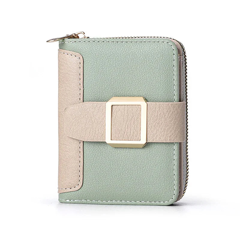 Compact green and beige leather wallet with gold buckle and zipper closure