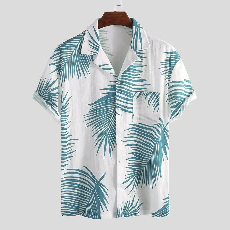 White short-sleeve button-up shirt with teal tropical palm leaf print on wooden hanger