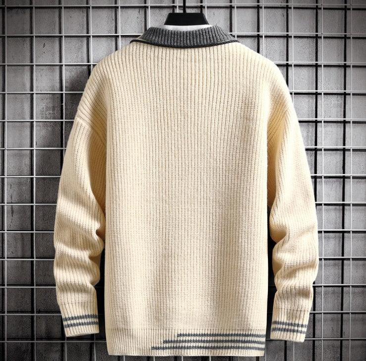 Back view of beige ribbed knit sweater with gray collar and stripe accents on cuffs and hem