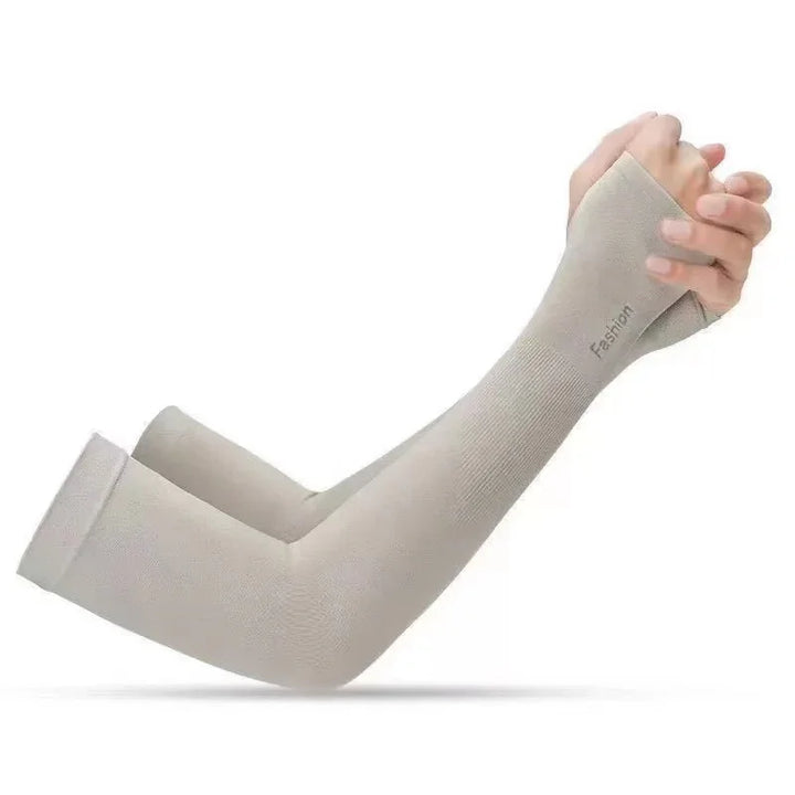 Beige breathable arm sleeves with thumb hole worn on crossed hands for sun protection and fashion