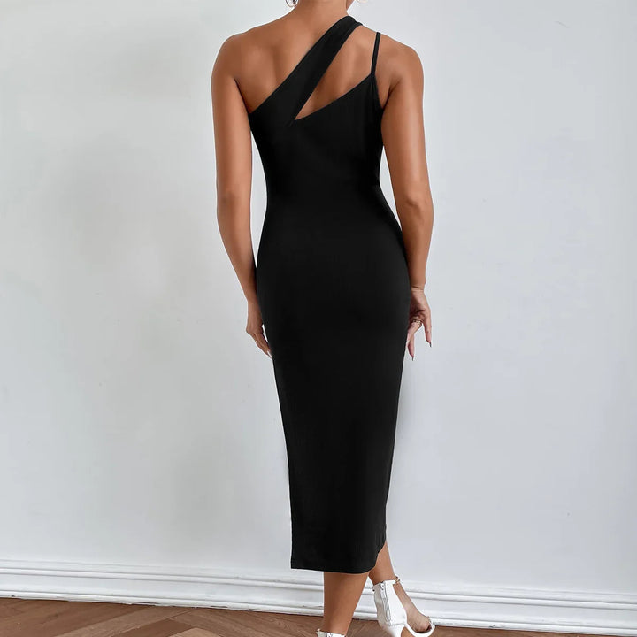 Back view of woman wearing sleek black asymmetrical midi dress with one-shoulder and cutout detail