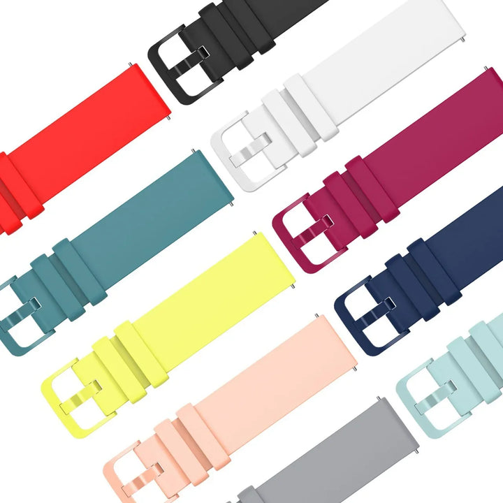 Colorful silicone watch bands in red, black, white, teal, yellow, pink, navy, gray, and light blue