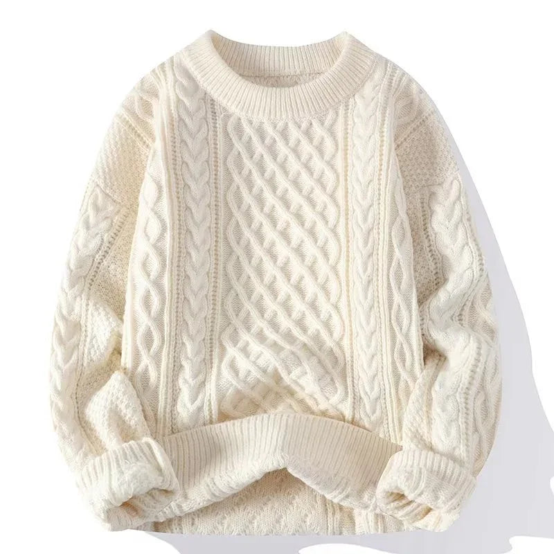 Cream white cable knit sweater with textured patterns and ribbed cuffs and hem