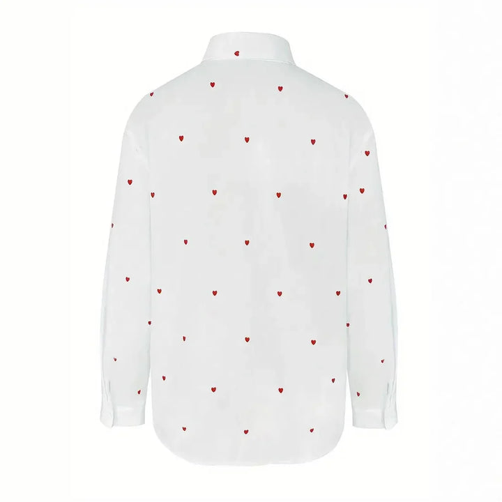 White long sleeve button-up shirt with small red heart patterns all over, shown from back