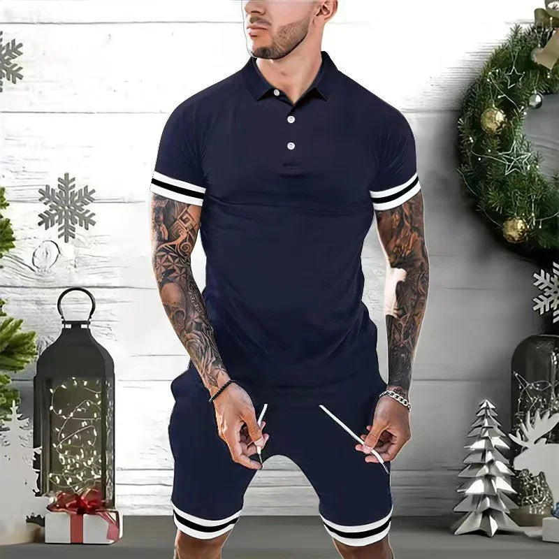 Man wearing navy blue polo shirt and matching shorts with white stripes on sleeves and hems in festive holiday decor