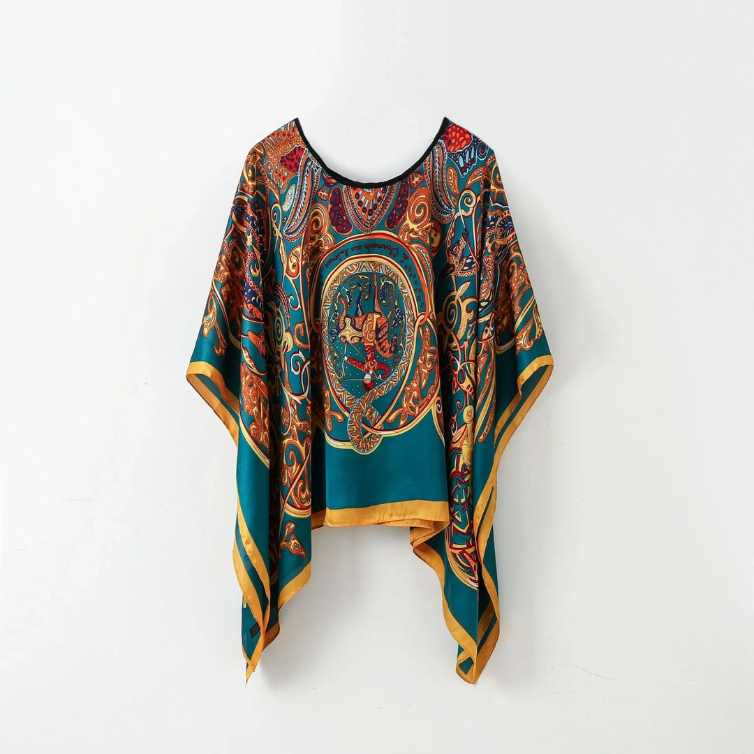 Teal silk poncho with ornate gold, red, and blue baroque paisley print and yellow border