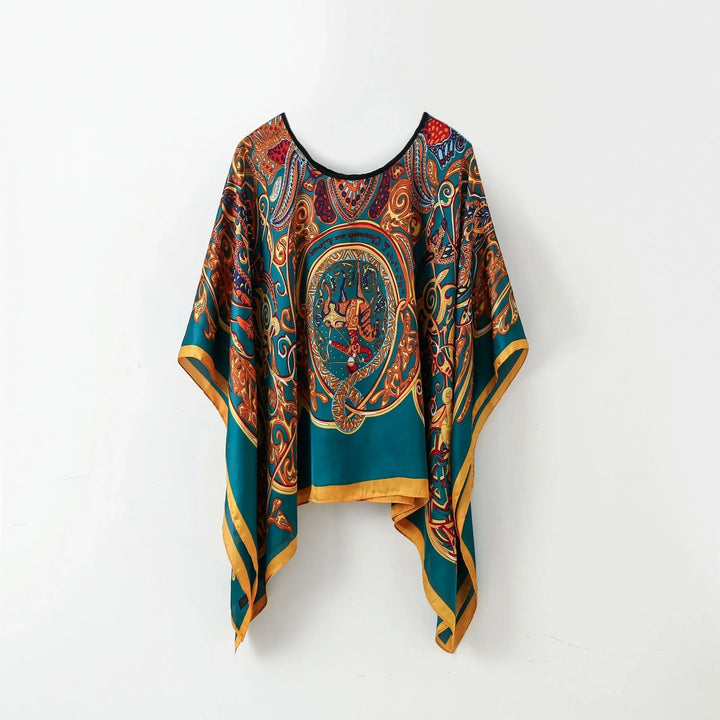 Teal silk poncho with ornate gold, red, and blue baroque paisley print and yellow border