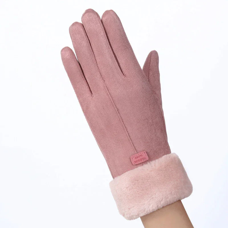 Pink suede winter glove with soft faux fur cuff and stitched detail on white background