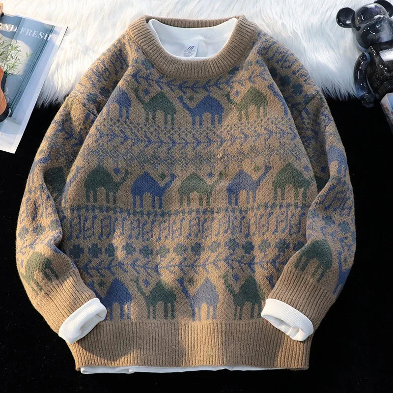 Beige wool sweater with blue and green camel patterns, layered over white shirt, cozy fashion
