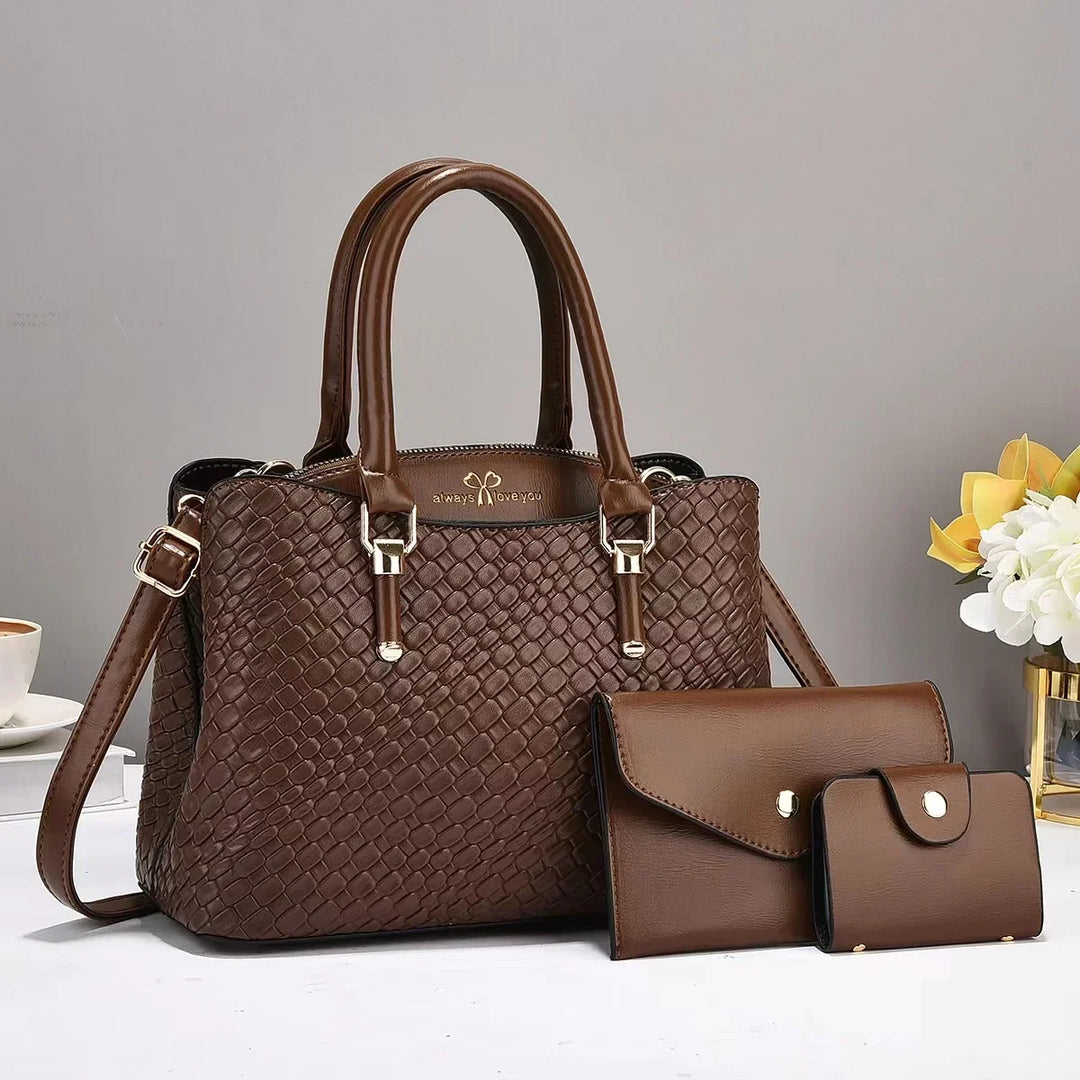 Brown woven leather handbag with matching brown wallet and cardholder on white surface