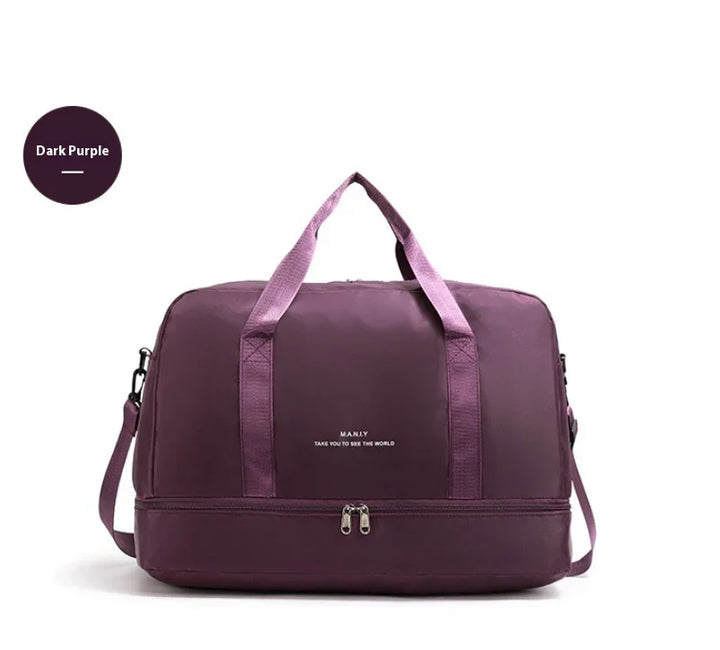 Dark purple travel duffel bag with shoulder strap and zipper, white MANLY logo