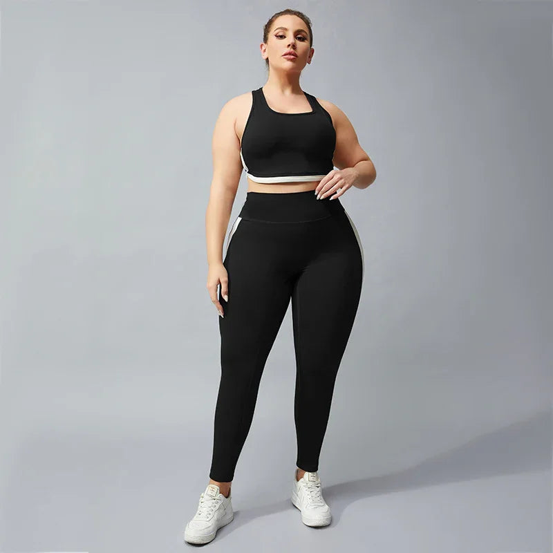 Plus size woman wearing black sports bra and leggings with white side stripes and white sneakers