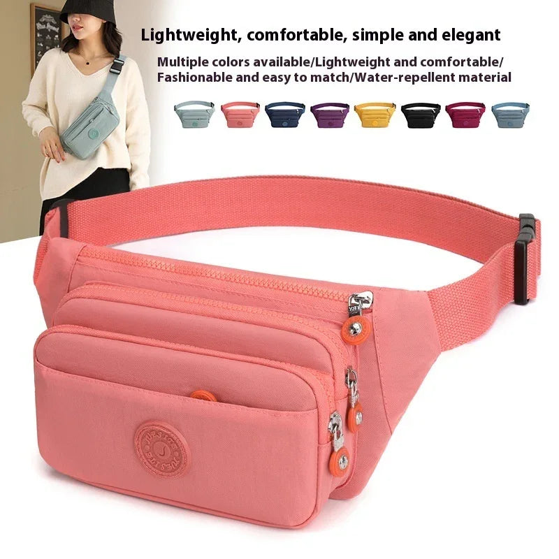 Lightweight pink water-repellent waist bag with multiple compartments and adjustable strap