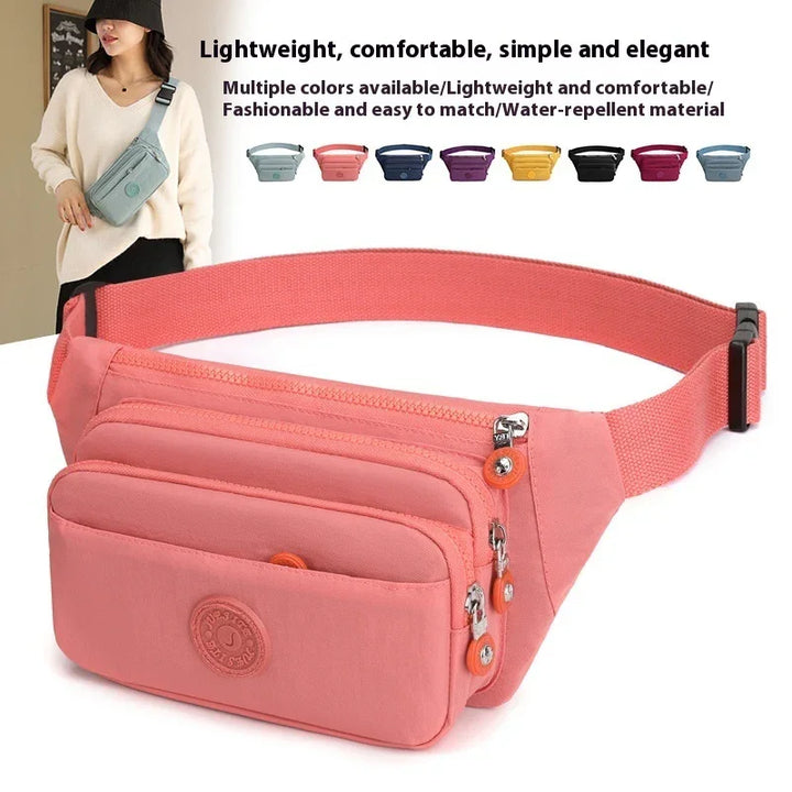 Lightweight pink water-repellent waist bag with multiple compartments and adjustable strap