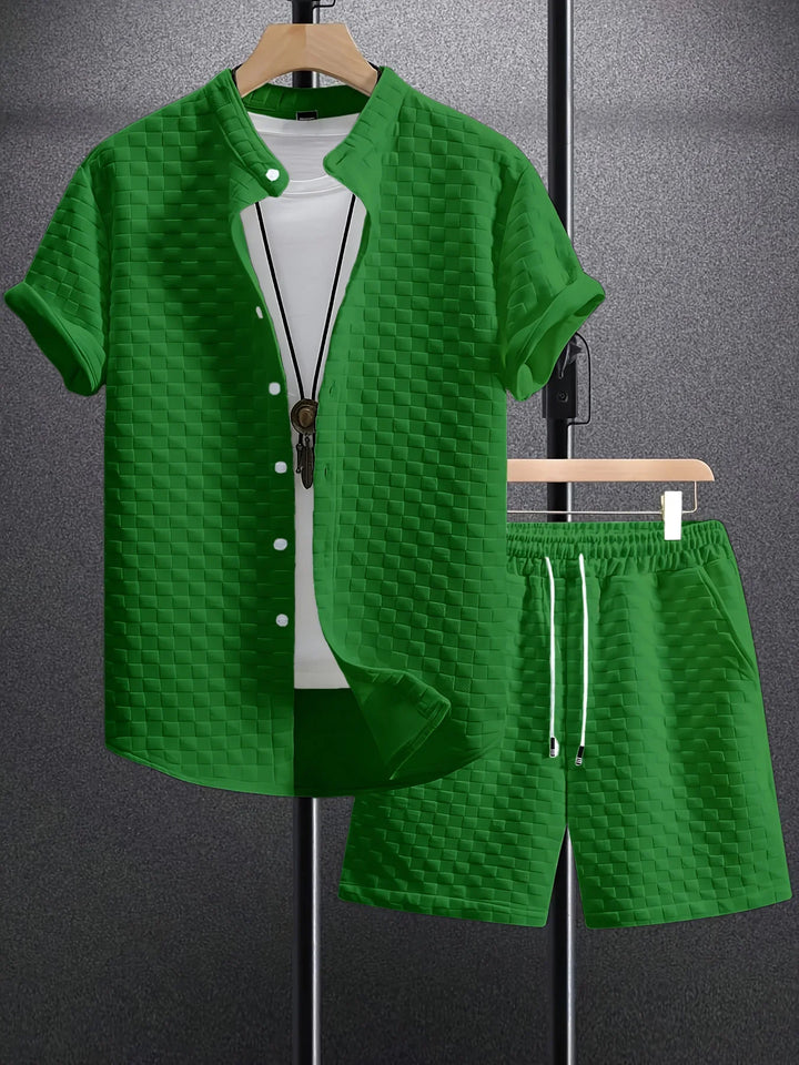 Green checkered short sleeve shirt and matching shorts with white T-shirt and necklace