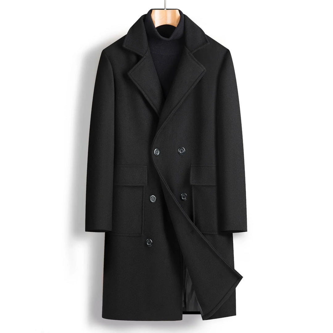 Black double-breasted wool coat with lapels and flap pockets on wooden hanger