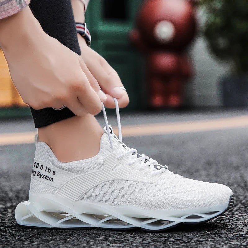 Close-up of hands tying laces on white lightweight sports sneaker with unique air-cushioned sole on street