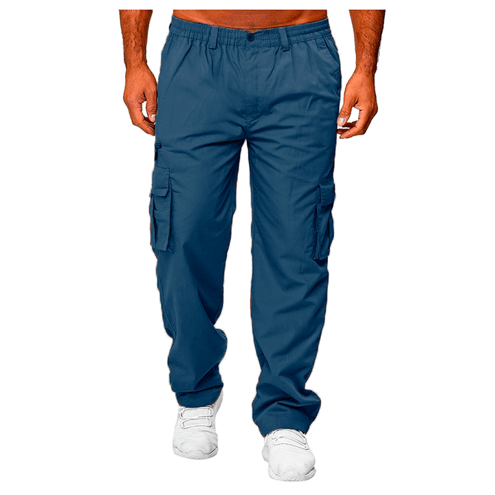 Men's blue cargo pants with multiple pockets, elastic waistband, and white sneakers