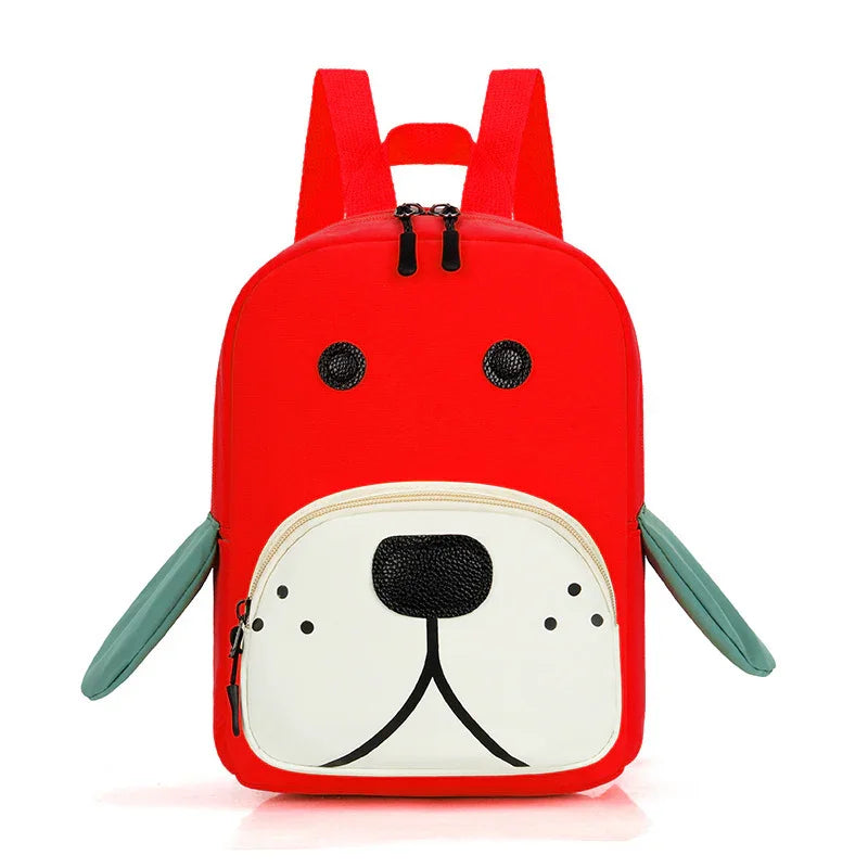 Red children's backpack shaped like a dog's face with black eyes, white snout pocket, and green ears