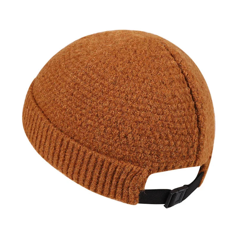 Brown textured knit beanie hat with ribbed edge and adjustable black strap