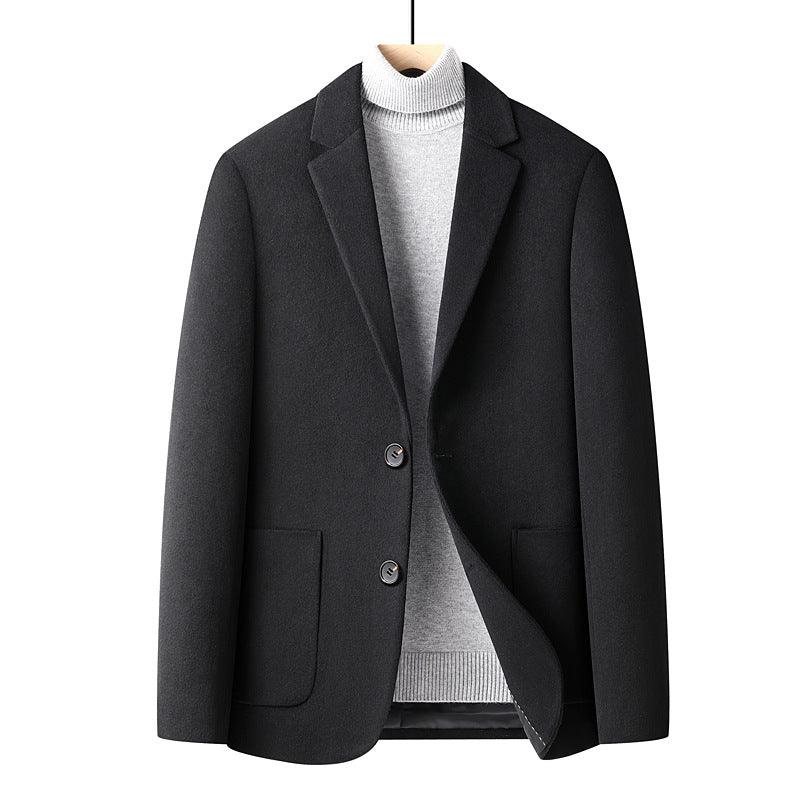 Black men's blazer jacket over light gray turtleneck sweater on wooden hanger