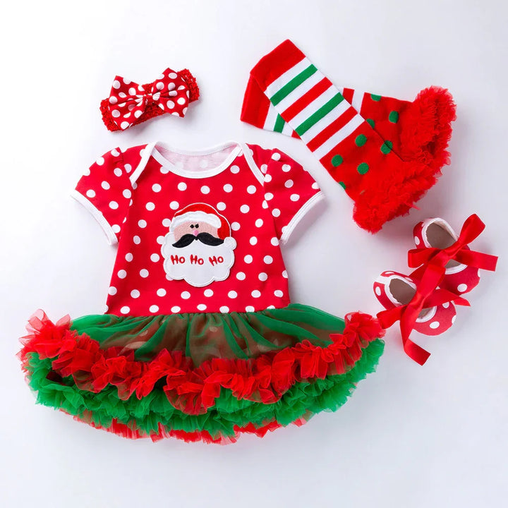 Red and green Christmas baby dress with Santa design, matching headband, striped leg warmers, and polka dot shoes