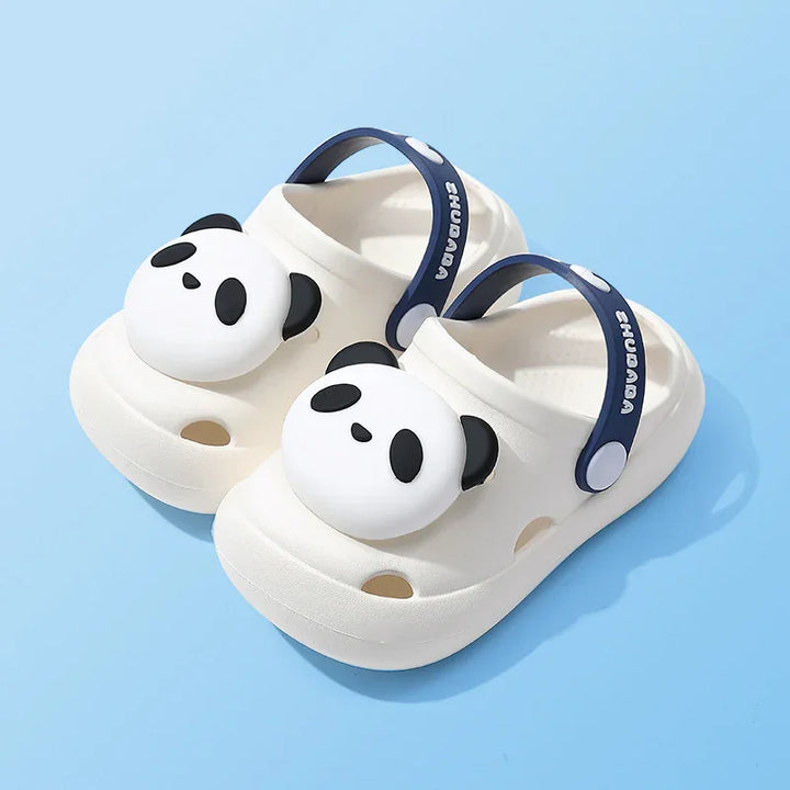 White kids sandals with panda face design and navy blue adjustable heel straps on light blue background