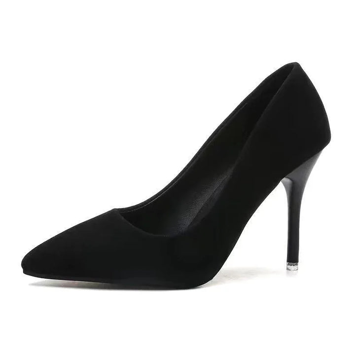 black pointed toe stiletto high heel pump on white background