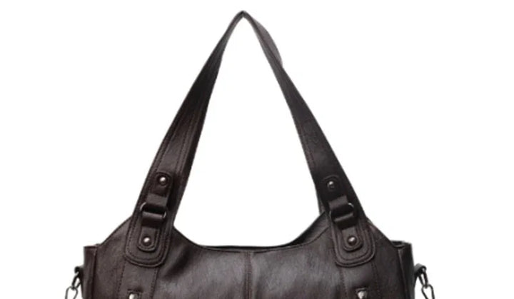 Black leather shoulder bag with double straps and silver hardware details