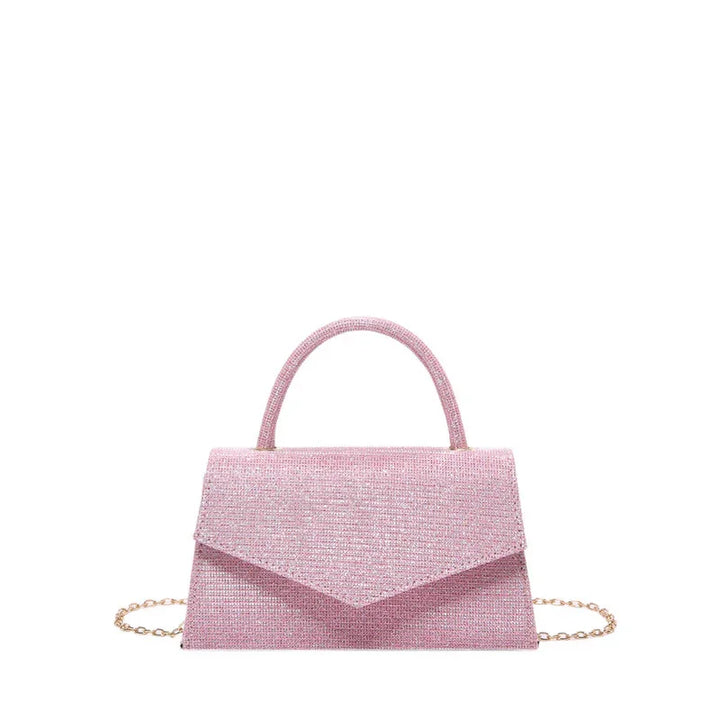 Elegant pink textured handbag with top handle and gold chain strap on white background
