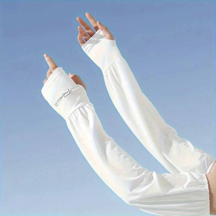 Person wearing white fingerless arm sleeves with text against a clear blue sky