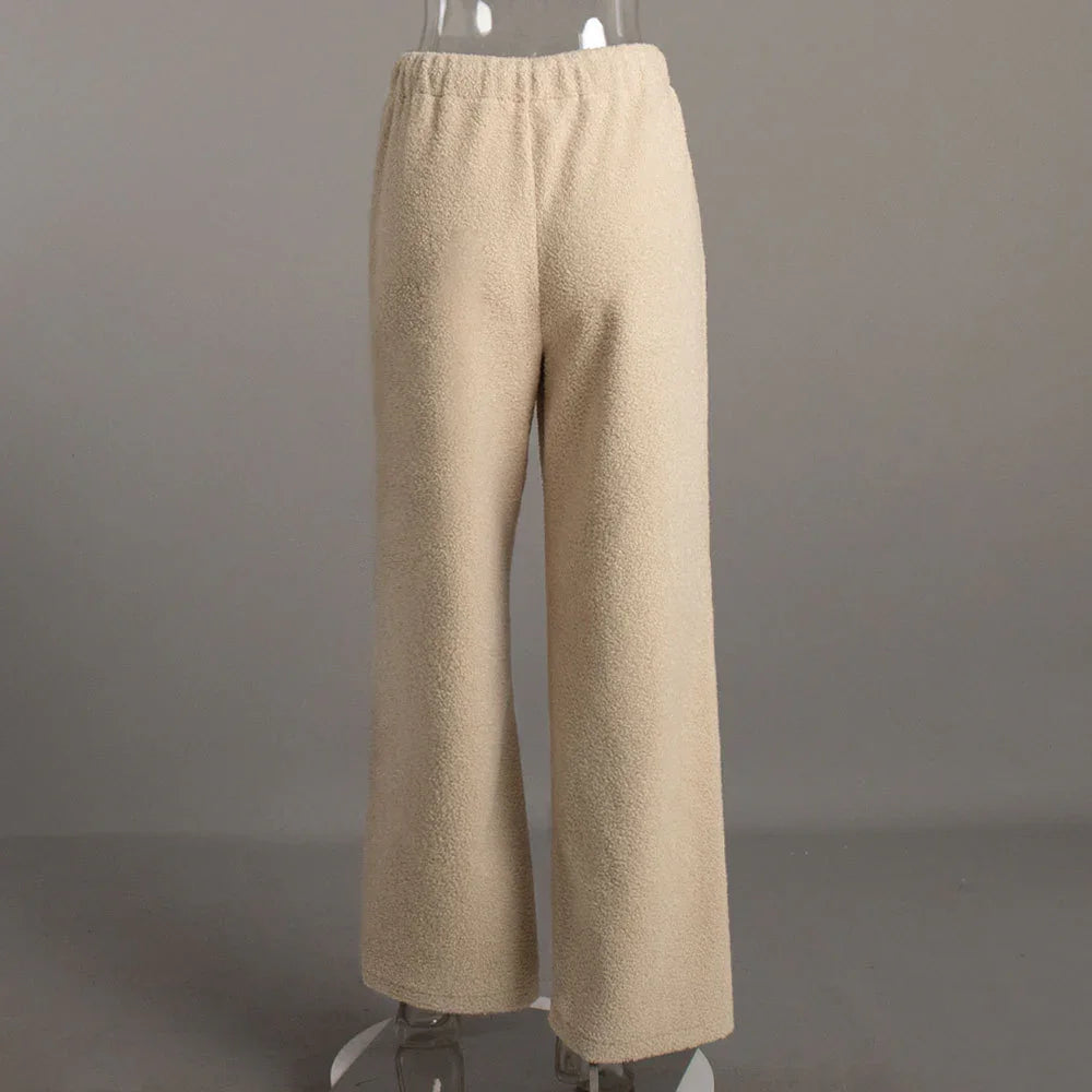 Beige fleece wide-leg pants with elastic waistband on transparent mannequin