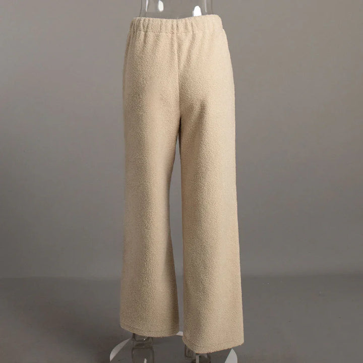 Beige fleece wide-leg pants with elastic waistband on transparent mannequin