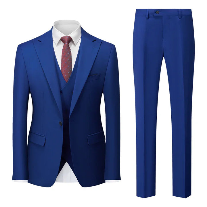 Elegant blue men's suit with matching trousers, white dress shirt, and red patterned tie