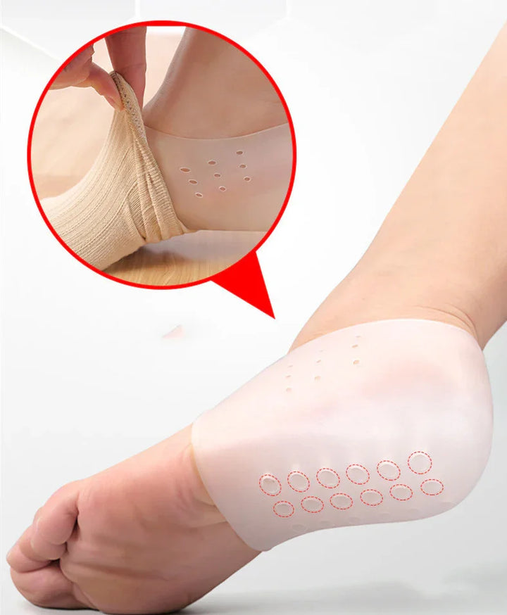 Silicone heel protector sleeve on foot with ventilation holes, shown worn and being put on