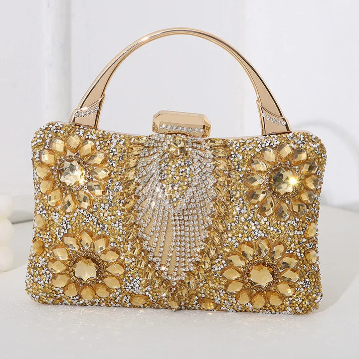 Elegant gold clutch handbag adorned with sparkling crystals and gemstone floral designs