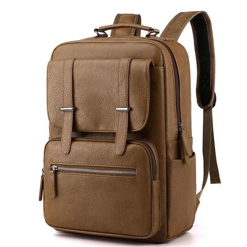 Brown leather backpack with front flap pocket, zippered compartment, and adjustable shoulder straps