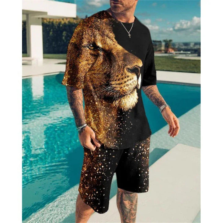 Man wearing black t-shirt and shorts with large lion face print standing by outdoor pool