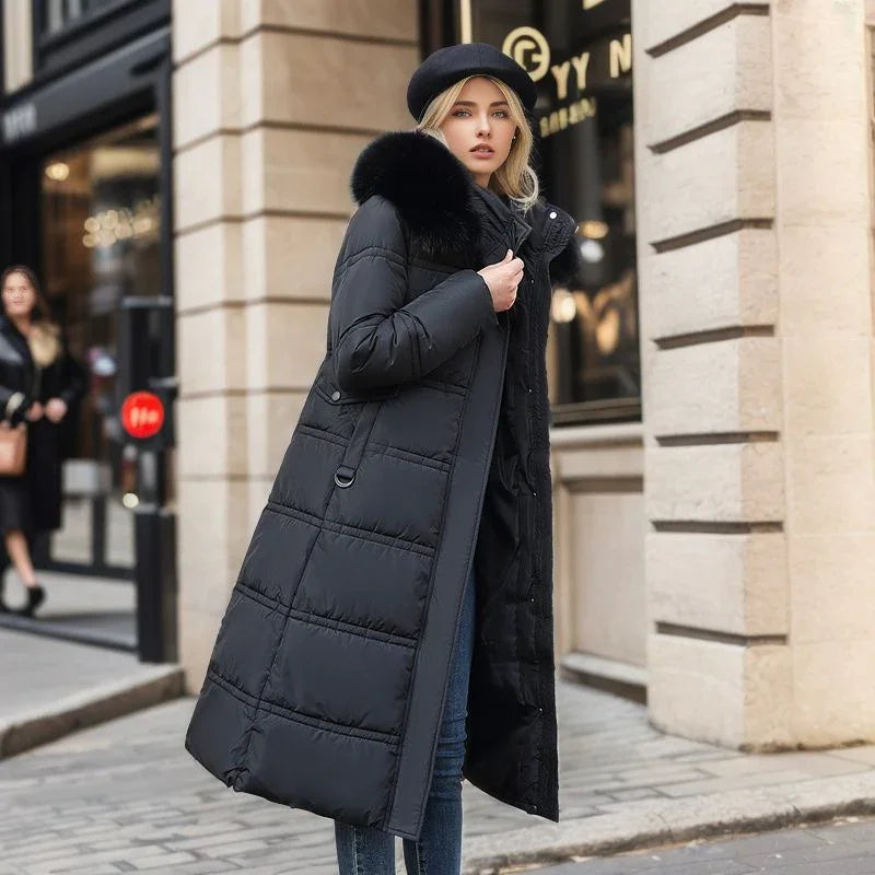Fashionable woman wearing long black puffer coat with fur collar and black beret on urban street
