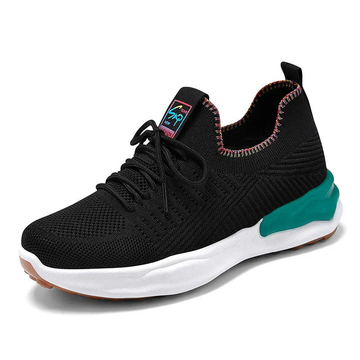 Black knitted athletic sneaker with multicolor trim, teal heel support, white sole, and black laces
