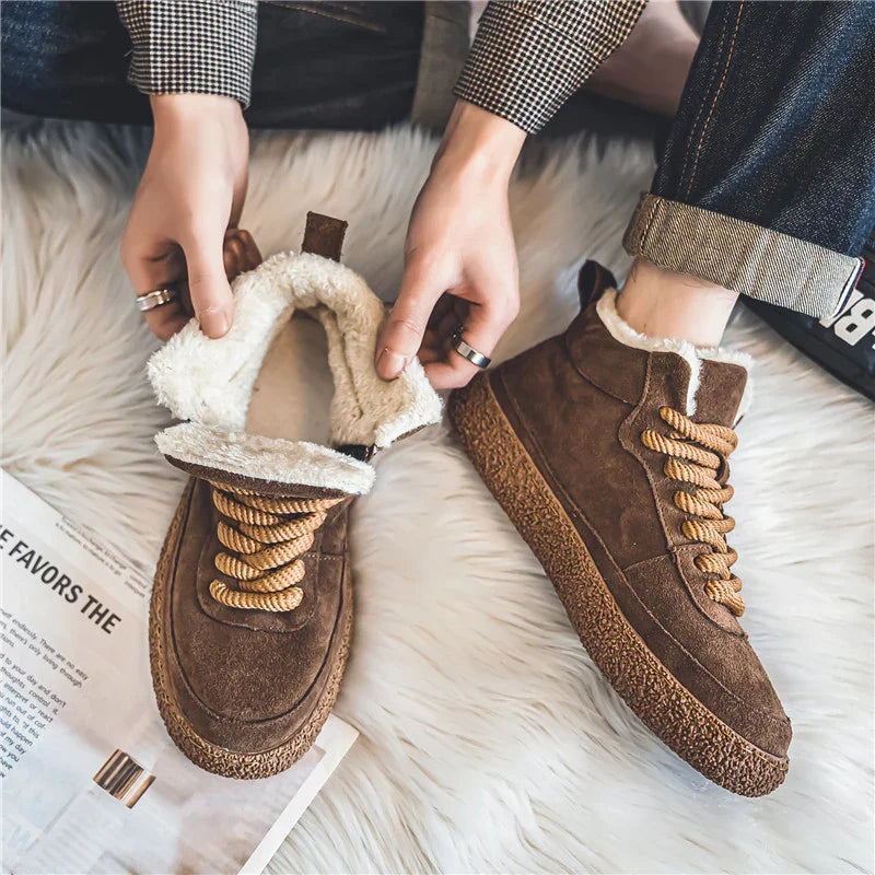 Brown suede winter boots with warm white fleece lining and thick laces, worn on white furry rug