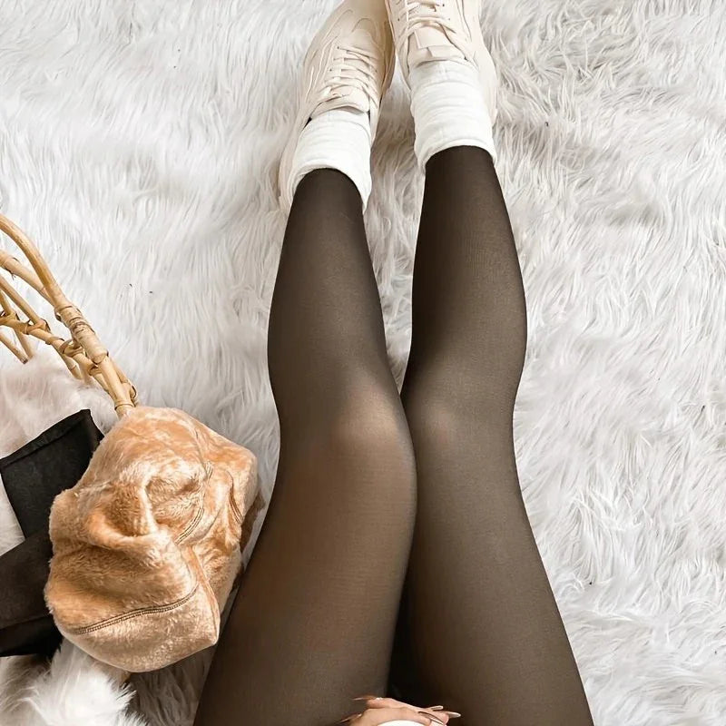 Legs wearing sheer black tights and white casual shoes on a fluffy white rug with a tan fur bag nearby