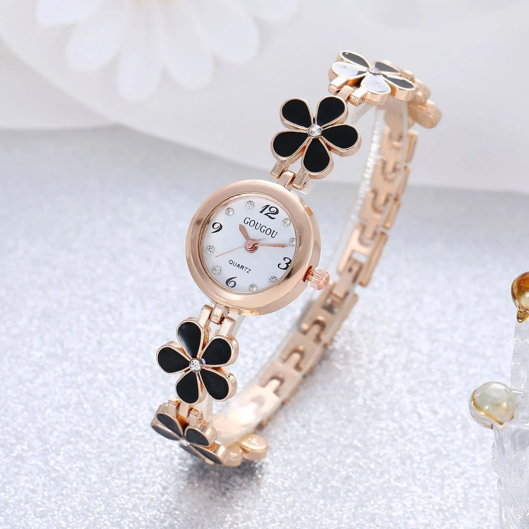 Elegant rose gold quartz wristwatch with white dial and black flower bracelet links