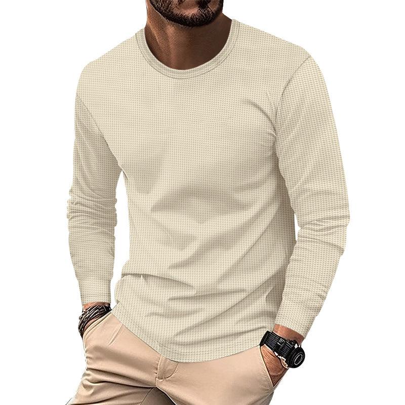 man wearing beige textured long-sleeve shirt with beige pants and black wristwatch