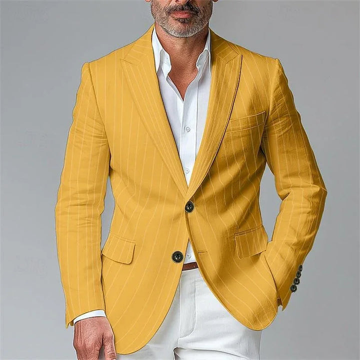 Man wearing a mustard yellow pinstripe blazer with black buttons and white shirt and pants