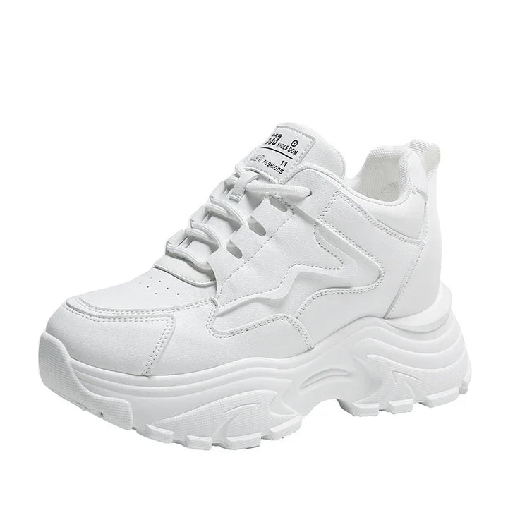 white chunky platform sneaker with textured sole and lace-up design