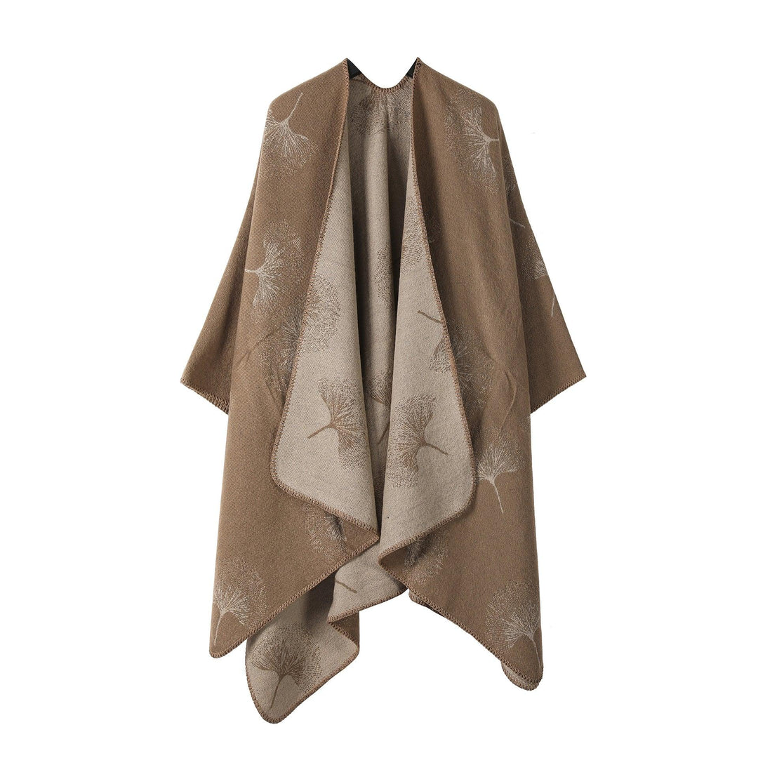 reversible brown and beige wool shawl with dandelion seed pattern, draped on hanger